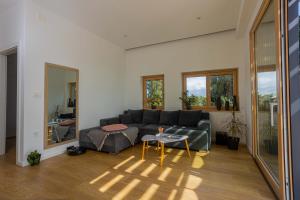 Posezení v ubytování AMAI APARTMENT