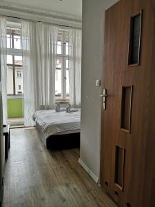Postel nebo postele na pokoji v ubytování Central Sopot