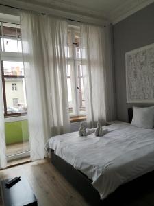 Postel nebo postele na pokoji v ubytování Central Sopot
