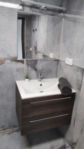 a bathroom with a sink and a mirror at Luxury Reed House in Balatonudvari