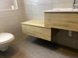 a bathroom with a toilet and a sink at Beauty apartment 3 rooms wi-fi in Netanya +9 photos
