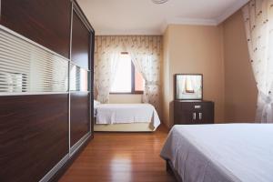מיטה או מיטות בחדר ב-Çağlar Villası