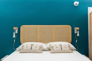 A bed or beds in a room at Casa Pratello