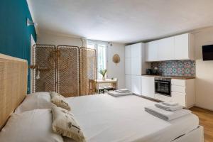 A bed or beds in a room at Casa Pratello
