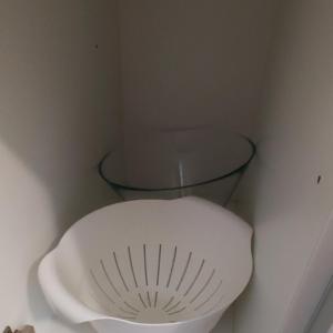 a white toilet in a corner with a glass bowl at Ruby studio 5min to Vantaa Airport and 20min to Helsinki center in Vantaa