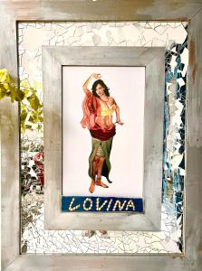 a picture of a woman in a picture frame at The Lovina Place in Mount Lavinia