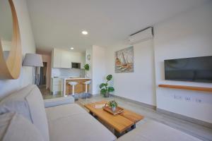 a living room with a couch and a table at ABLANCAS - La Restinga in La Restinga