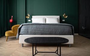 A bed or beds in a room at Salotto Room Boutique Pescara