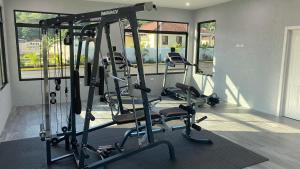 a gym with several tread machines in a room at The Roseville in Ocho Rios