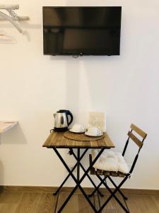 TV a/nebo společenská místnost v ubytování Atipico B&B