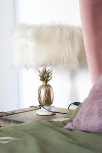 a table with a gold pineapple on top of it at Cozy & Charming City Apartment in Vienna