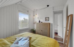 a bedroom with a large bed and a window at 2 Bedroom Gorgeous Home In Skjern in Skjern
