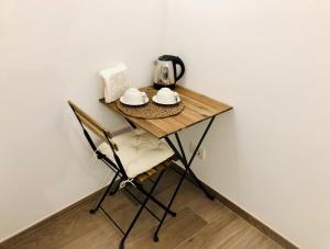 Příslušenství pro přípravu čaje a kávy v ubytování Atipico B&B