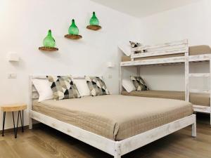 Postel nebo postele na pokoji v ubytování Atipico B&B