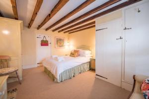 a bedroom with a bed in a room at The Way Southwold in Southwold