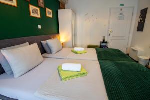 Postel nebo postele na pokoji v ubytování Rooms BAUMAN