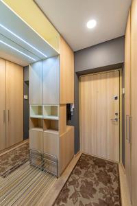 a locker room with a door and a closet at Deluxe river view apartment by Polo Apartment in Kaunas