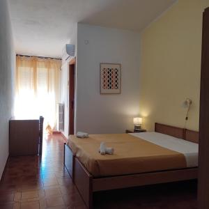Postel nebo postele na pokoji v ubytování Piccolo Hotel Nuova gestione