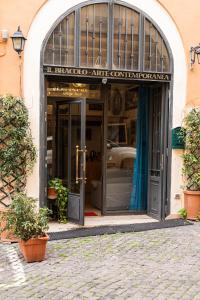 an entrance to a building with an open door at Appartamento Monti in Rome