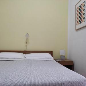 Postel nebo postele na pokoji v ubytování Piccolo Hotel Nuova gestione