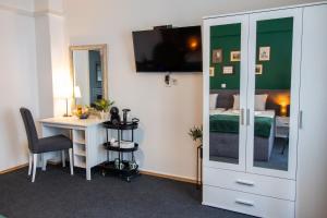 TV a/nebo společenská místnost v ubytování Rooms BAUMAN