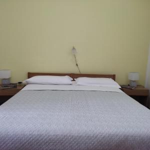 Postel nebo postele na pokoji v ubytování Piccolo Hotel Nuova gestione