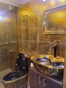 a bathroom with a sink and a mirror at Stunning 1-Bed Apartment in Dhaka close to airport in Dhaka