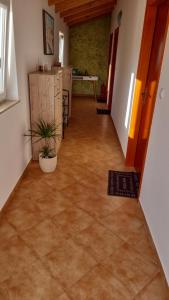 a hallway of a house with a tile floor at Sobe Anja in Brtonigla