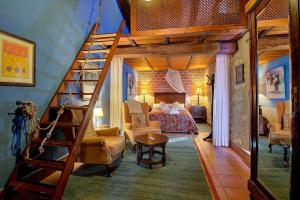 a bedroom with a loft bed and a staircase at Casa Gallinera in Benissiva +129 photos