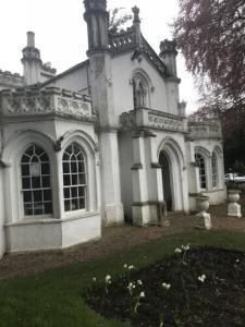 an old white building with a tower on top of it at The Priory Hotel in Louth