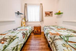 Ein Bett oder Betten in einem Zimmer der Unterkunft Huize Mare