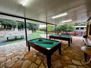 two pool tables on a patio with a view of a park at PARQUE MANANTIAL in Hohenau