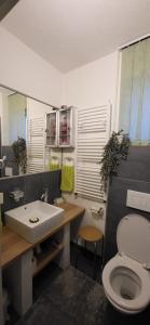 Koupelna v ubytování Rooms BAUMAN