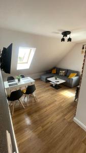a living room with a couch and a table at Apartament Loft in Elblag