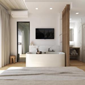 ein Schlafzimmer mit einer weißen Badewanne und einem TV an der Wand in der Unterkunft Hanim Boutique Hotel in Chania