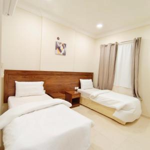 Cama o camas de una habitación en فندق الساعي Alsai Hotel