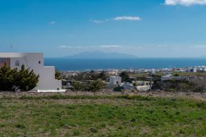 a view of the city and mountains from a house at Litmus in Fira