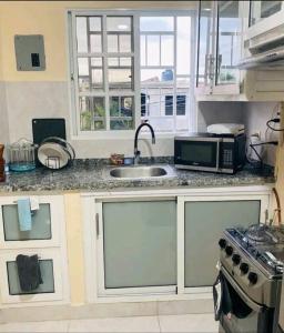 A kitchen or kitchenette at Apartamento Familiar Luz del Sol S.D