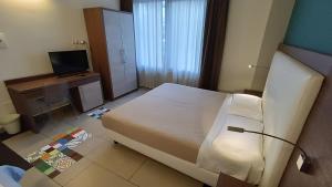 Postel nebo postele na pokoji v ubytování Hotel Don Giovanni