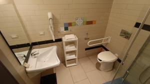 Koupelna v ubytování Hotel Don Giovanni