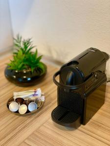 a coffee maker sitting on top of a table at Ferienwohnung David im Haus Waldblick - Bad Bergzabern in Bad Bergzabern