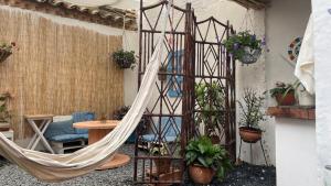 a hammock in the middle of a room at Deluxe Taida Chalet in Villa de Leyva