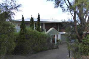 a house with trees in front of it at Sea Banksia in Denmark