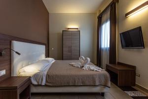 Postel nebo postele na pokoji v ubytování Hotel Don Giovanni
