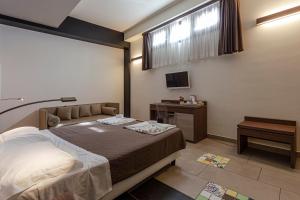 Postel nebo postele na pokoji v ubytování Hotel Don Giovanni