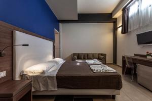 Postel nebo postele na pokoji v ubytování Hotel Don Giovanni