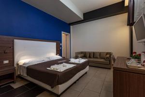 Postel nebo postele na pokoji v ubytování Hotel Don Giovanni