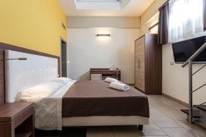 Postel nebo postele na pokoji v ubytování Hotel Don Giovanni