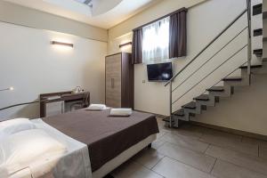 Postel nebo postele na pokoji v ubytování Hotel Don Giovanni