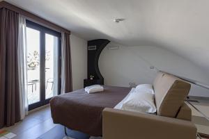 Postel nebo postele na pokoji v ubytování Hotel Don Giovanni